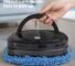 robot vacuum cleaner cleaning living room floor