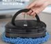 robot vacuum cleaner cleaning living room floor